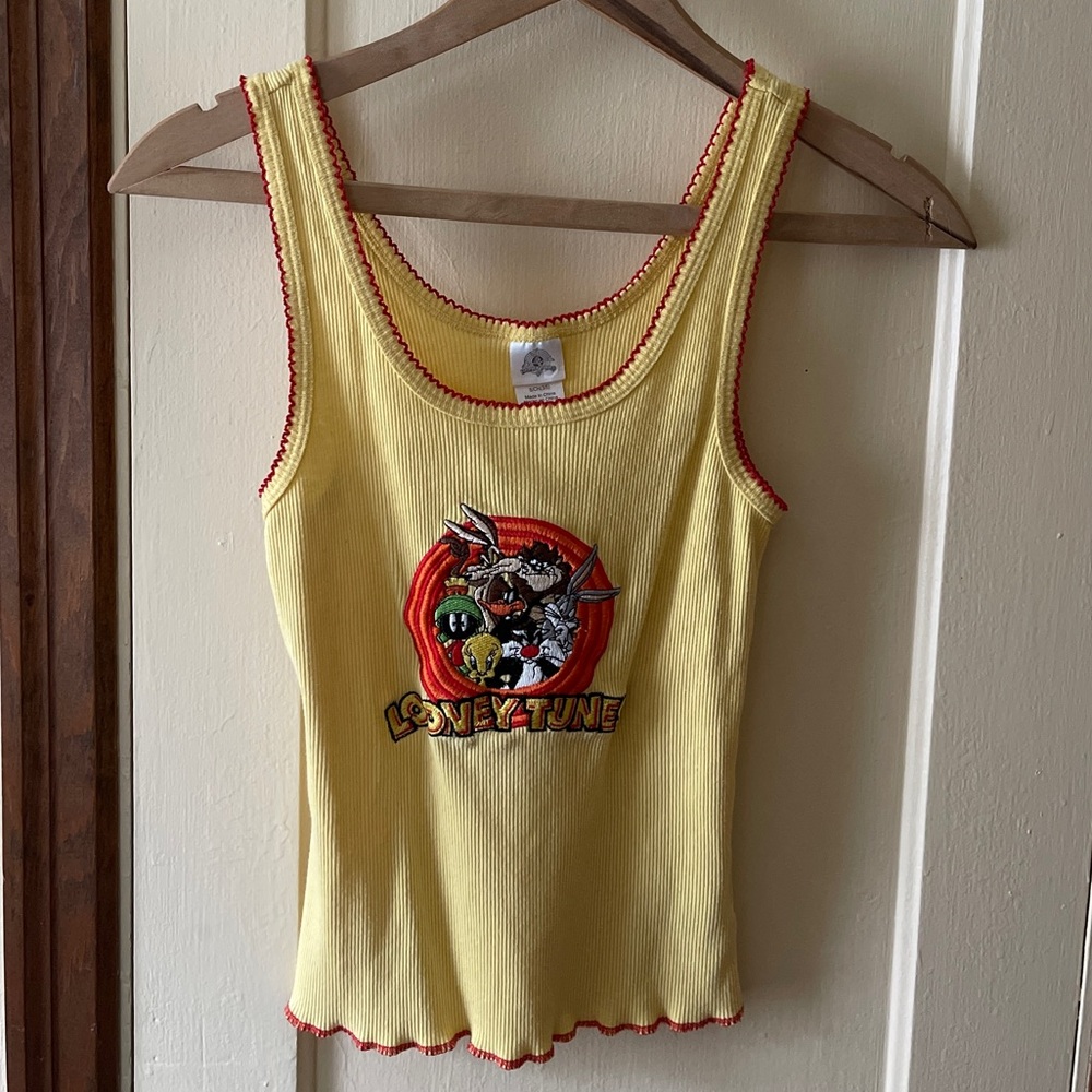 Vintage embroidered ribbed yellow Looney Tunes tank top with red stitching.